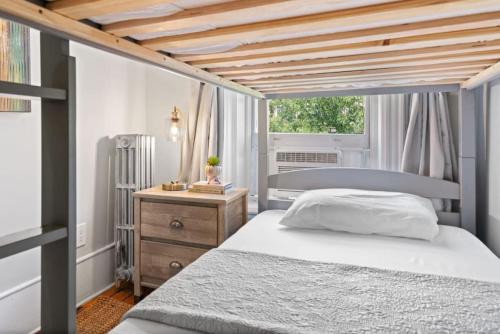 a bedroom with a bed and a wooden ceiling at Newly Renovated 3BR Oasis Walk to Columbia Uni in New York