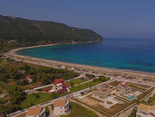 an aerial view of a beach and the ocean at Thines villas in Lefkada Town