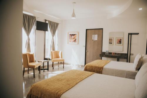Postel nebo postele na pokoji v ubytování MCI HOTEL