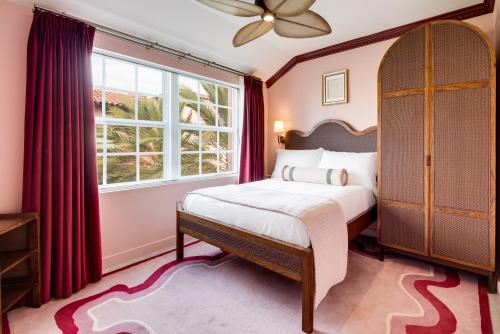 a bedroom with a bed and a window at Esme Miami Beach in Miami Beach