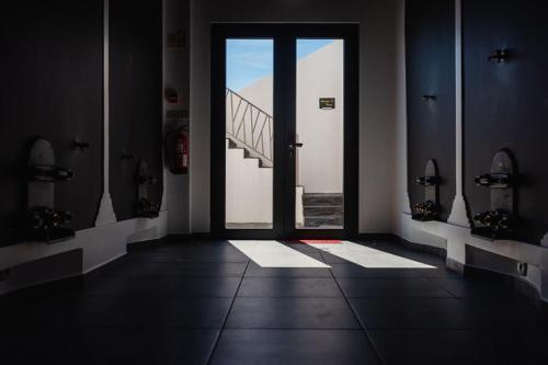 a hallway with a door with a view of a bridge at Gamboas Place in Olhalvo