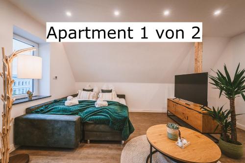 a bedroom with a bed and a tv with the words apartment i won at Sadebo Apartments 4 oder 7 Gäste - Parkplatz - Küche - zentral in Lübeck