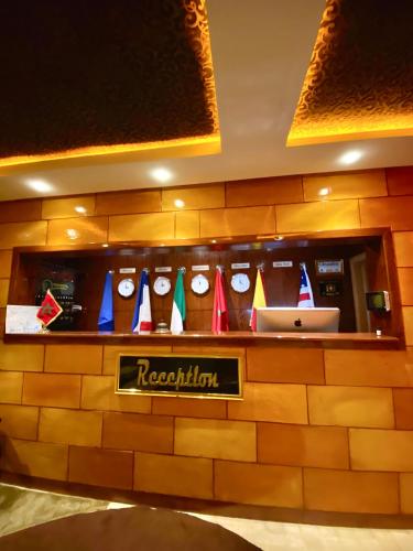 a reception counter in a hotel with colorful signs at Appart Hôtel Oleandro in Casablanca