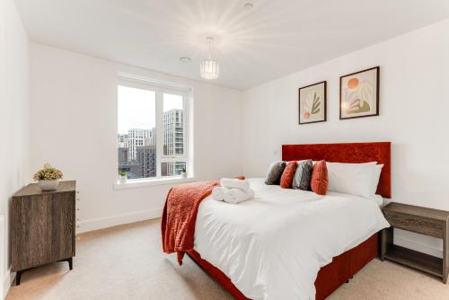 a bedroom with a large bed and a window at CannyCity in London