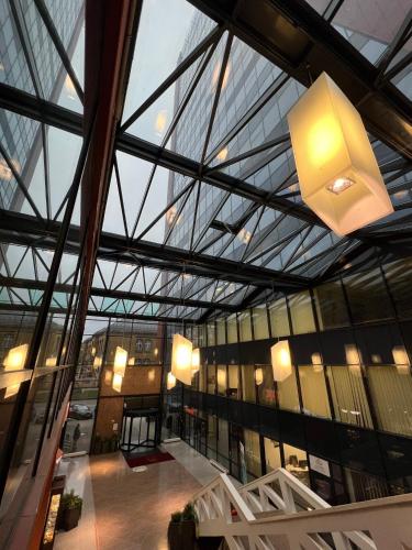 a view of a building with a glass ceiling at ALL - Amberstone Lux Loft in Klaipėda