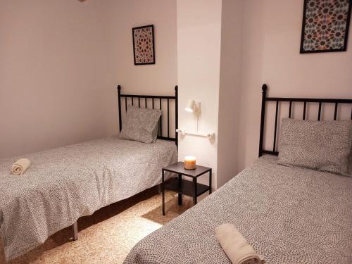 A bed or beds in a room at Casa Abuela Antonia