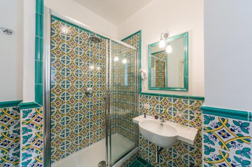a bathroom with a sink and a shower at Relais San Giacomo in Maiori