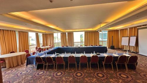 a large meeting room with a large table and chairs at Padova Hotel in Beirut