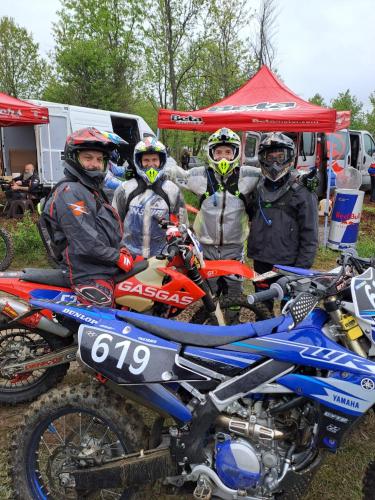 a group of people standing around a dirt bike at HOTEL ΗΩ (ΞΕΝΩΝΑΣ ΤΣΙΑΧΡΗΣ) in Morfovoúnion
