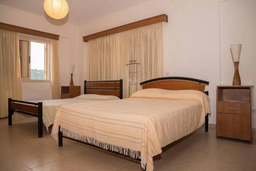 Ένα ή περισσότερα κρεβάτια σε δωμάτιο στο Villa Mouttali