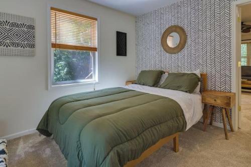 a bedroom with a bed and a mirror and a window at Mango Mountain House Pocono in Albrightsville