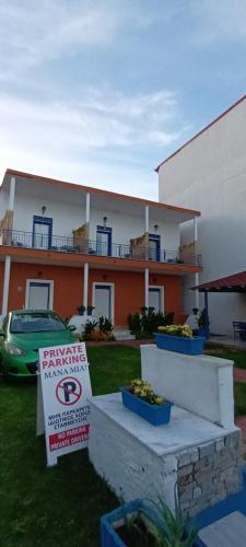 a house with a parking sign in front of it at Mana mia Seaside Apartments in Leptokaria