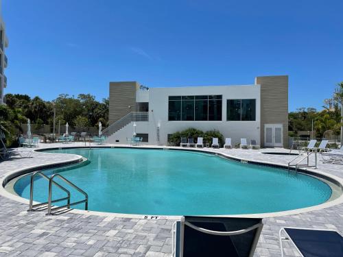 a large swimming pool in front of a building at Seahorse 316 in Sarasota