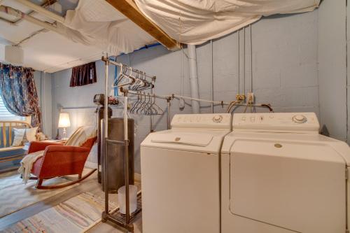 a laundry room with a washer and dryer in a room at Harmony Home with Fire Pit 5 Mi to Niagara Cave! 