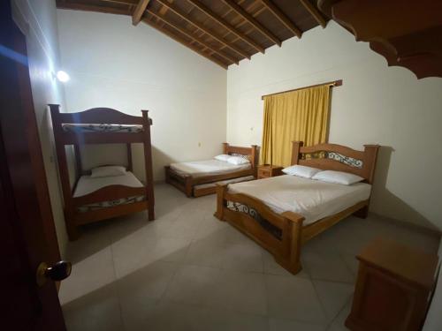 Postel nebo postele na pokoji v ubytování Hotel Tamarindo Resort