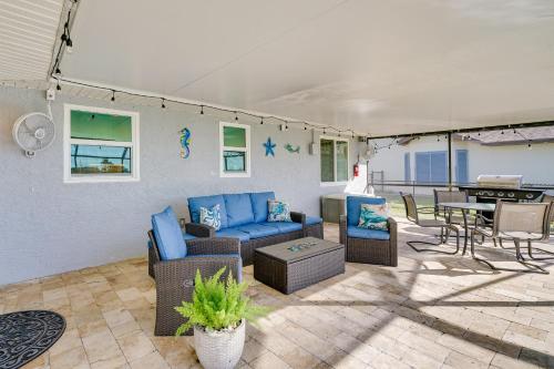 a patio with a couch and chairs and a table at Punta Gorda Oasis with Saltwater Pool and Gas Grill! in Punta Gorda