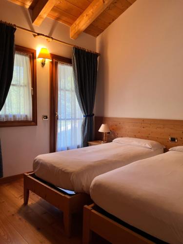 Cama o camas de una habitación en Agriturismo Busa dei Sbrase