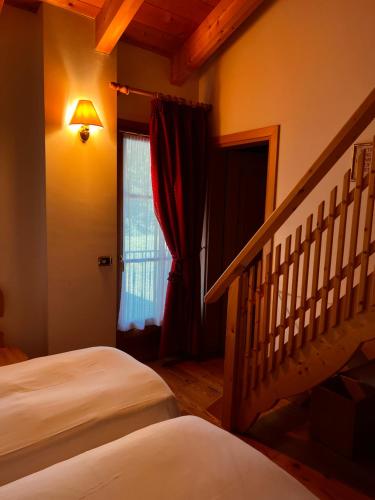 Cama o camas de una habitación en Agriturismo Busa dei Sbrase