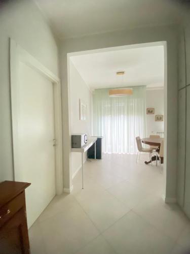 an empty room with a desk and a table at Home & B in Arezzo