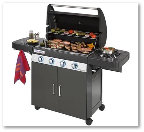 a barbecue grill with meat and food on it at Modern Beach House long stay discounts in Sarnia