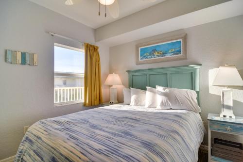 a bedroom with a large bed and a window at Ocean View Top-Floor Sunset Vistas Condo! in St Pete Beach
