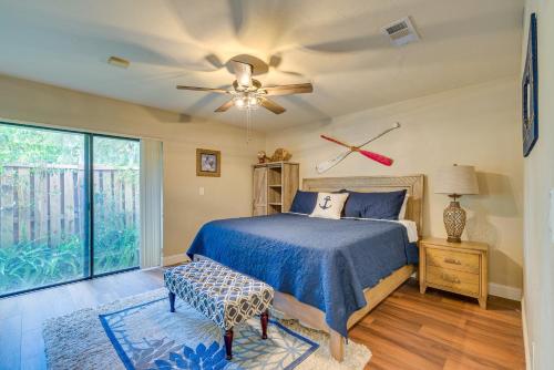 a bedroom with a bed and a ceiling fan at Waterfront Dunnellon Retreat with River Access! in Dunnellon