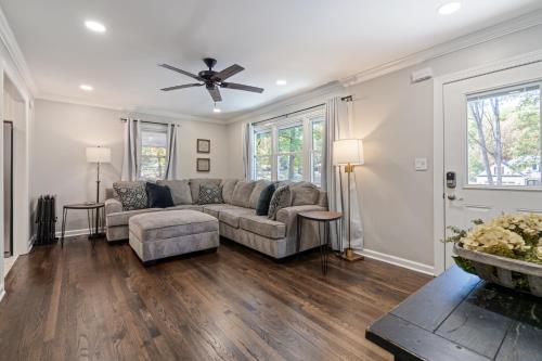 a living room with a couch and a ceiling fan at Rustic 3BR Home in a Natural Cartersville Getaway in Cartersville