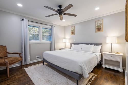 a bedroom with a bed and a ceiling fan at Rustic 3BR Home in a Natural Cartersville Getaway in Cartersville