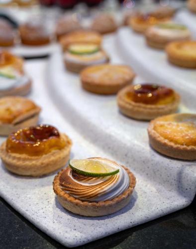 a bunch of pastries sitting on a tray at Radisson Blu Okoume Palace Hotel, Libreville in Libreville