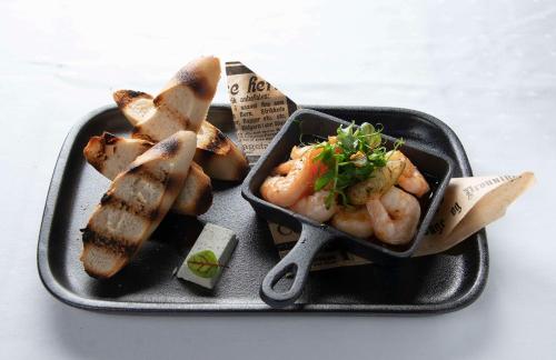 a plate of food with shrimp and bread on it at Park Inn by Radisson Oslo Airport Hotel West in Gardermoen