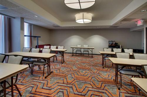 a classroom with tables and chairs on a carpet at Drury Inn & Suites Evansville East in Evansville