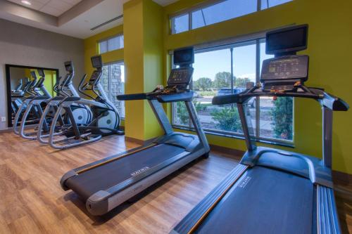 a gym with several cardio machines in a row at Drury Inn & Suites Huntsville Space & Rocket Center in Huntsville