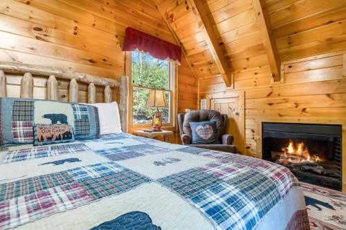 a bedroom with a bed and a fireplace at A Higher Calling Get 951 worth of FREE area attraction tickets for each paid day! in Pigeon Forge