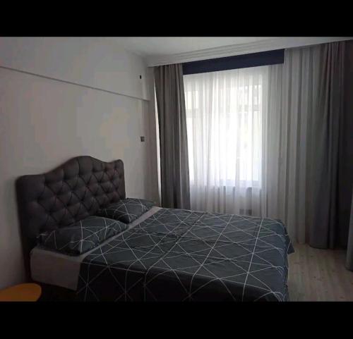 Кровать или кровати в номере Stylish Apartment