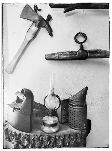 a group of tools are hanging on a wall at Cinderella Guitars in Czartoria