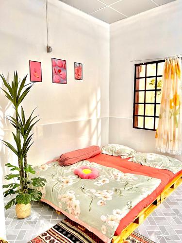 a bedroom with a large bed in a room at Homestay YẾN HÒA in Ấp Bình Hưng