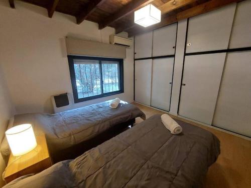Ένα ή περισσότερα κρεβάτια σε δωμάτιο στο Casa Chalet Las Colinas