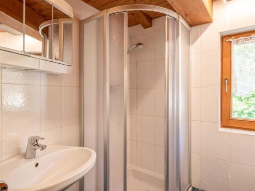 a bathroom with a sink and a shower at Appartement Brixnerwirt IV in Brixen im Thale