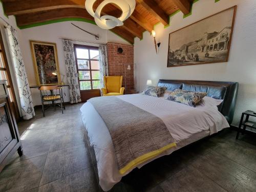 a bedroom with a large bed in a room at Maison Bodroz appartamento Charme in Aosta