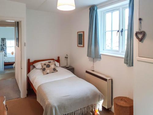 Posteľ alebo postele v izbe v ubytovaní East End Cottage
