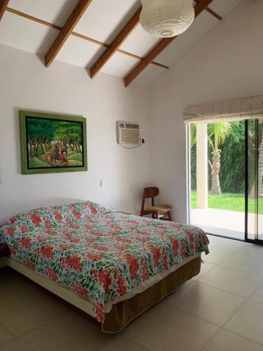 En eller flere senge i et værelse på Casa Suiza en Vichayito