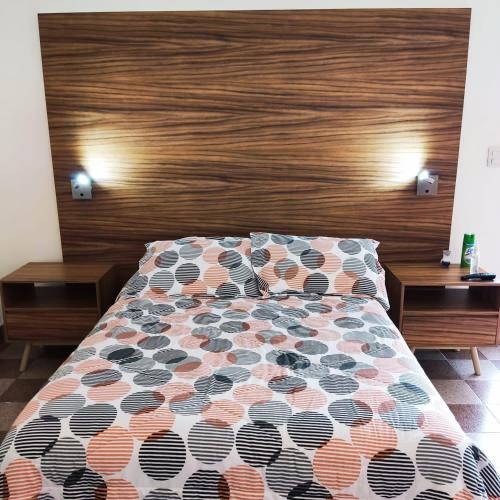 Una cama o camas en una habitación de VILLA D-SPITIA Apartamentos en renta