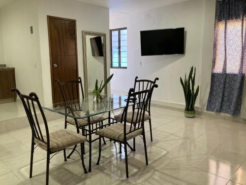 Una televisión o centro de entretenimiento en VILLA D-SPITIA Apartamentos en renta
