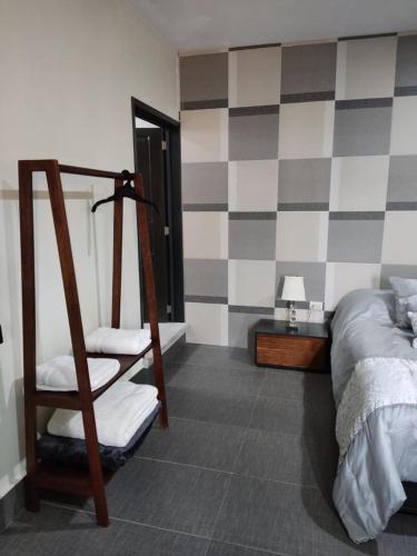 Una cama o camas en una habitación de VILLA D-SPITIA Apartamentos en renta