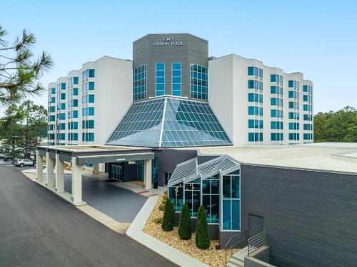 a building with a solarium on top of it at Crowne Plaza Atlanta NE - Norcross by IHG in Norcross