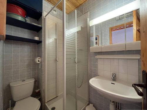 a small bathroom with a toilet and a sink at Appartement Peisey-Nancroix-Plan Peisey, 1 pièce, 4 personnes - FR-1-757-79 in Peisey-Nancroix