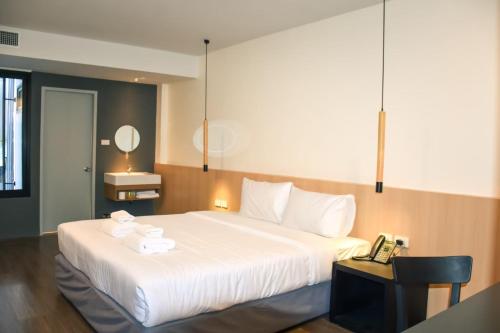 Postel nebo postele na pokoji v ubytování Grandview Residence