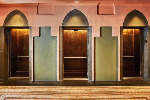 a row of elevators in a building at Downtown Los Angeles Proper Hotel, a Member of Design Hotels in Los Angeles