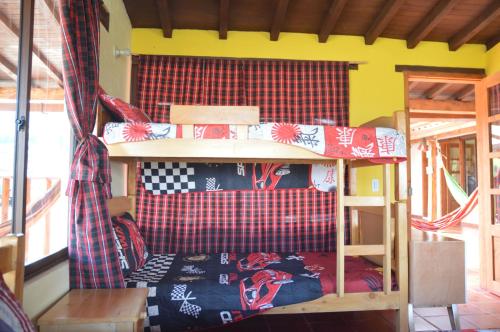 a room with a bunk bed in a house at Hacienda la Aurora Finca agroturística in Sotaquirá