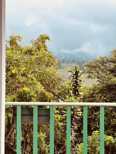 a balcony with a view of a garden at La Casa de colour Filandia, Quindio in Filandia